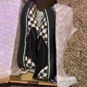 Black and white checkered board Vans